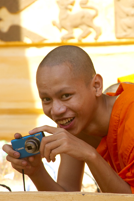 Monk taking photos, Wat Siskatet Temple Vientiane Laos